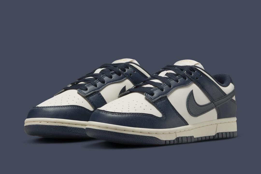 Made with eco-friendly materials, the Nike Dunk Low Next Nature WMNS “Olympic” builds with an off-white, phantom upper with deep navy leather overlays and gold branding on the heel branding and the tongue tag.